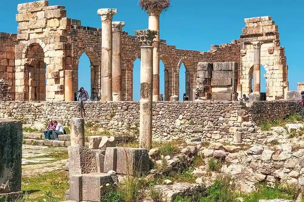 Roman columns and arches at the Volubilis archaeological site, Morocco