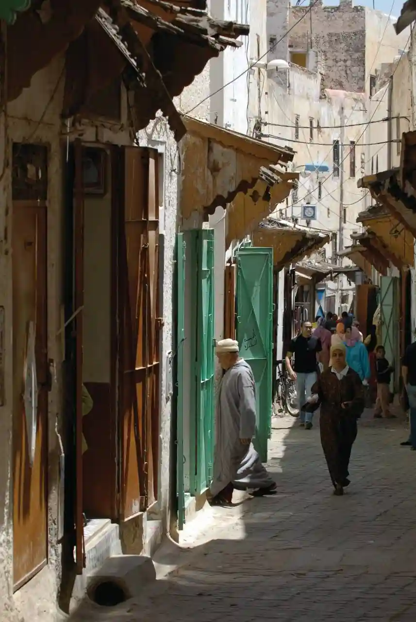 Narrow working street lined with small shops in Sefrou medina