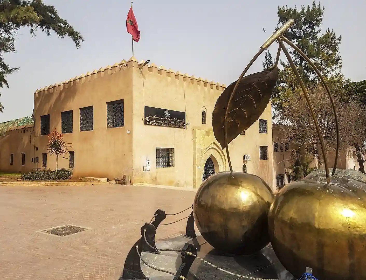 Golden cherry monument in front of the town hall of Sefrou, Morocco