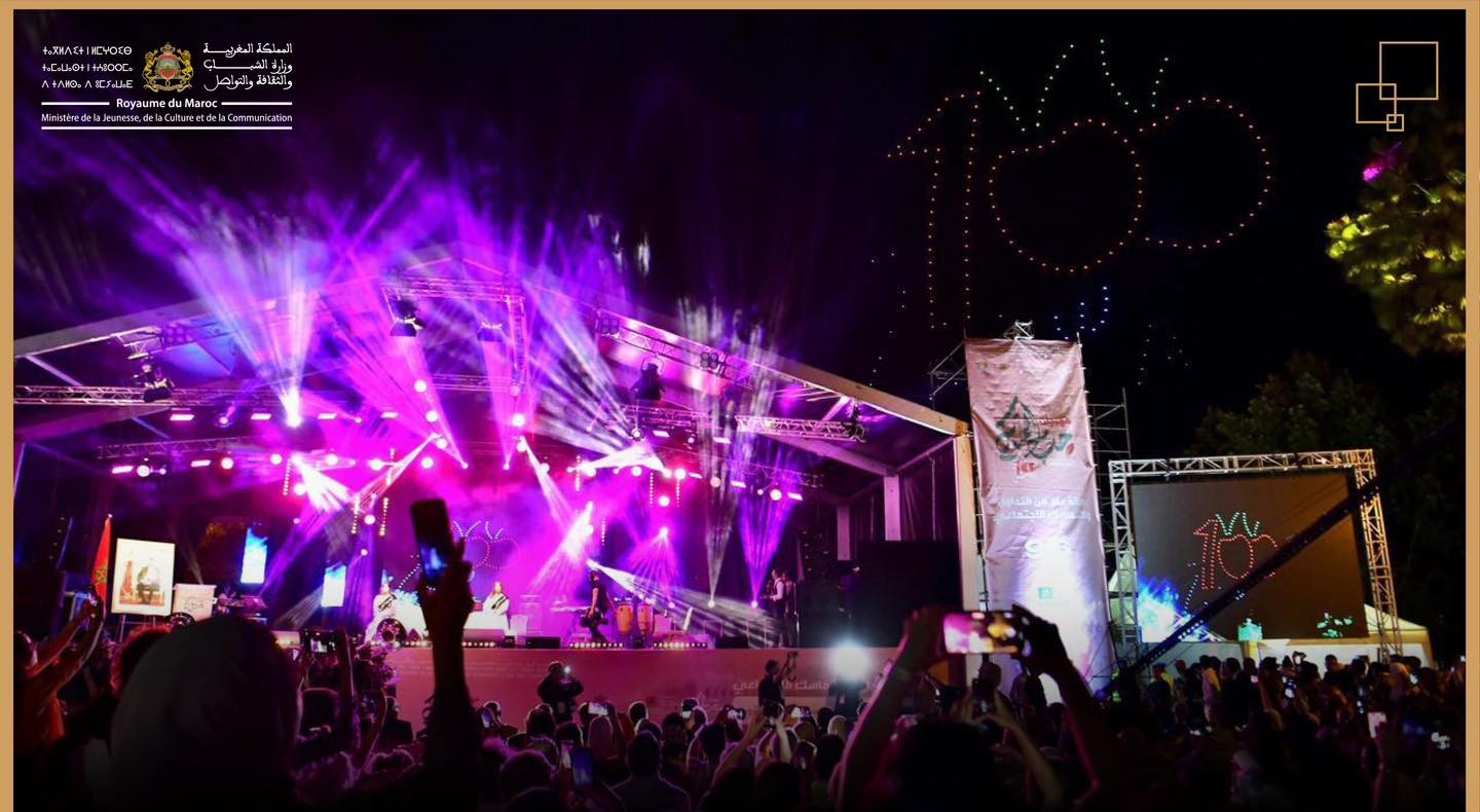 Large illuminated concert stage and cherry-shaped drone display at the 2024 Sefrou festival