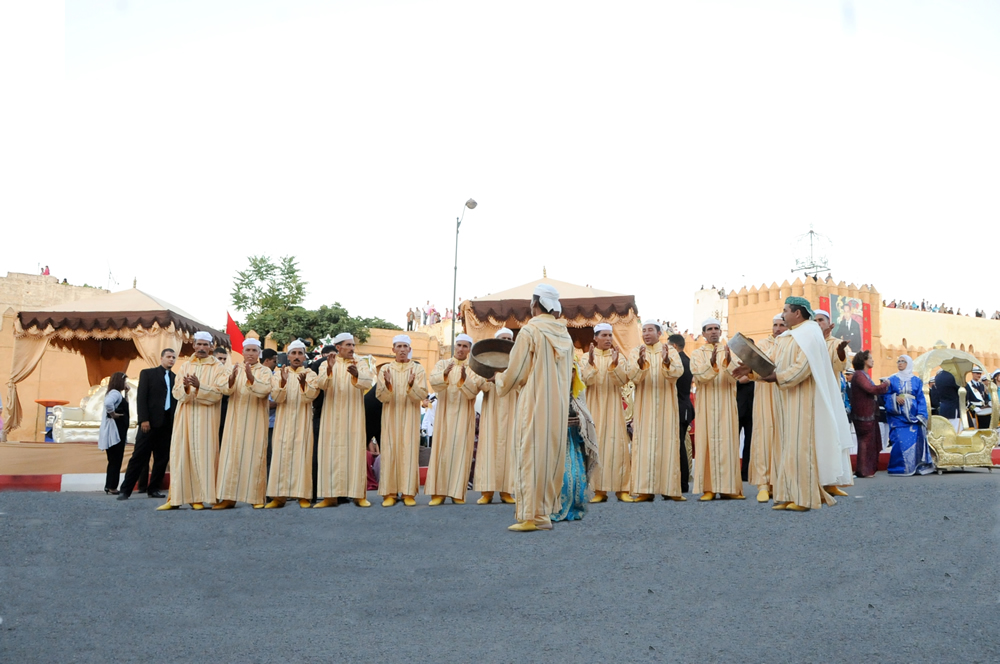 An Amazigh Ahidous troupe singing and playing frame drums at the Sefrou festival