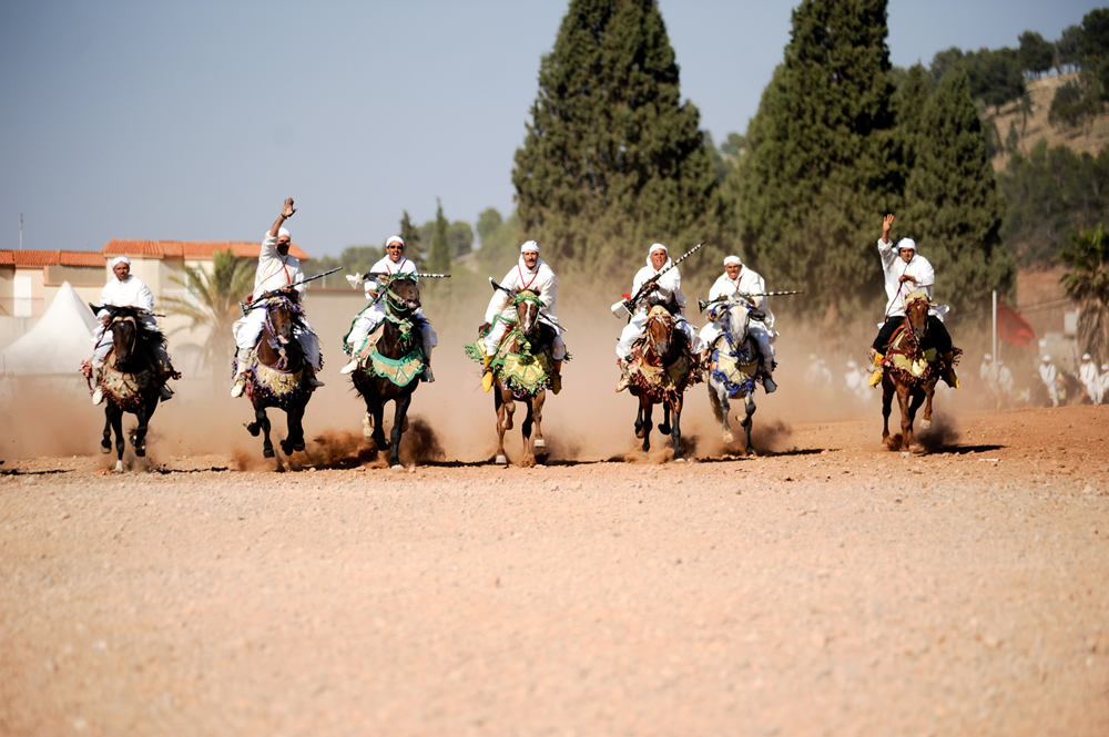 Fantasia horsemen riding together during the Sefrou Cherry Festival
