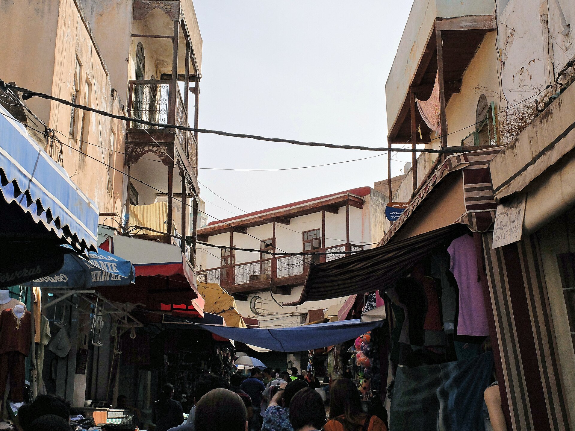 Busy market lane and projecting balconies in the former mellah of Sefrou