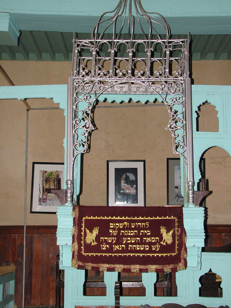 Decorated bimah and Hebrew textile inside a historic synagogue in Sefrou